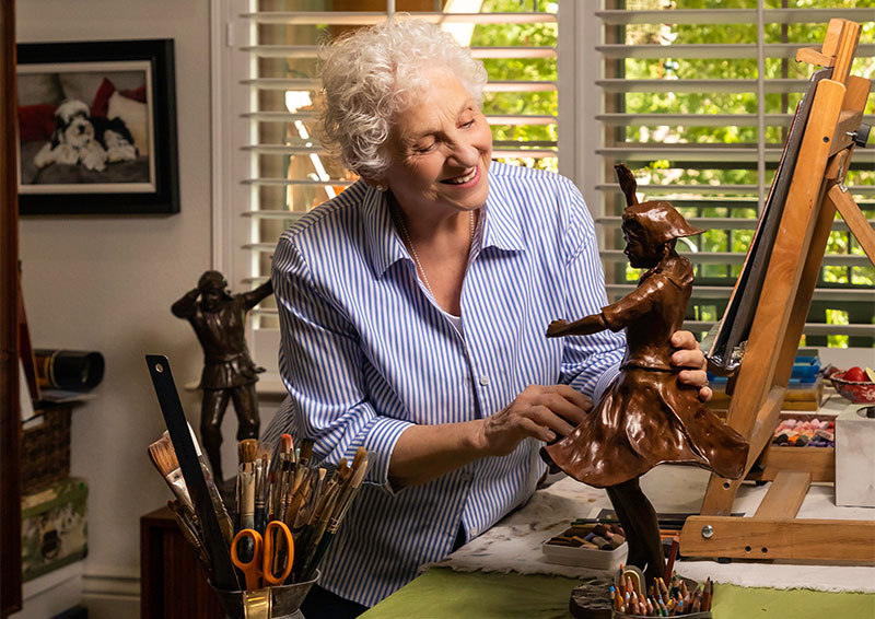 senior woman with small sculpture