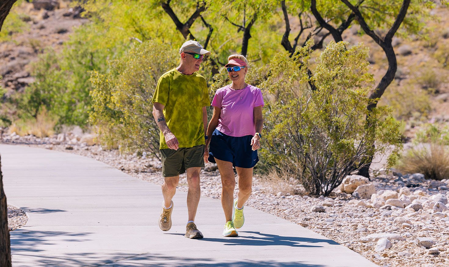 seniors walking outside on walking trail