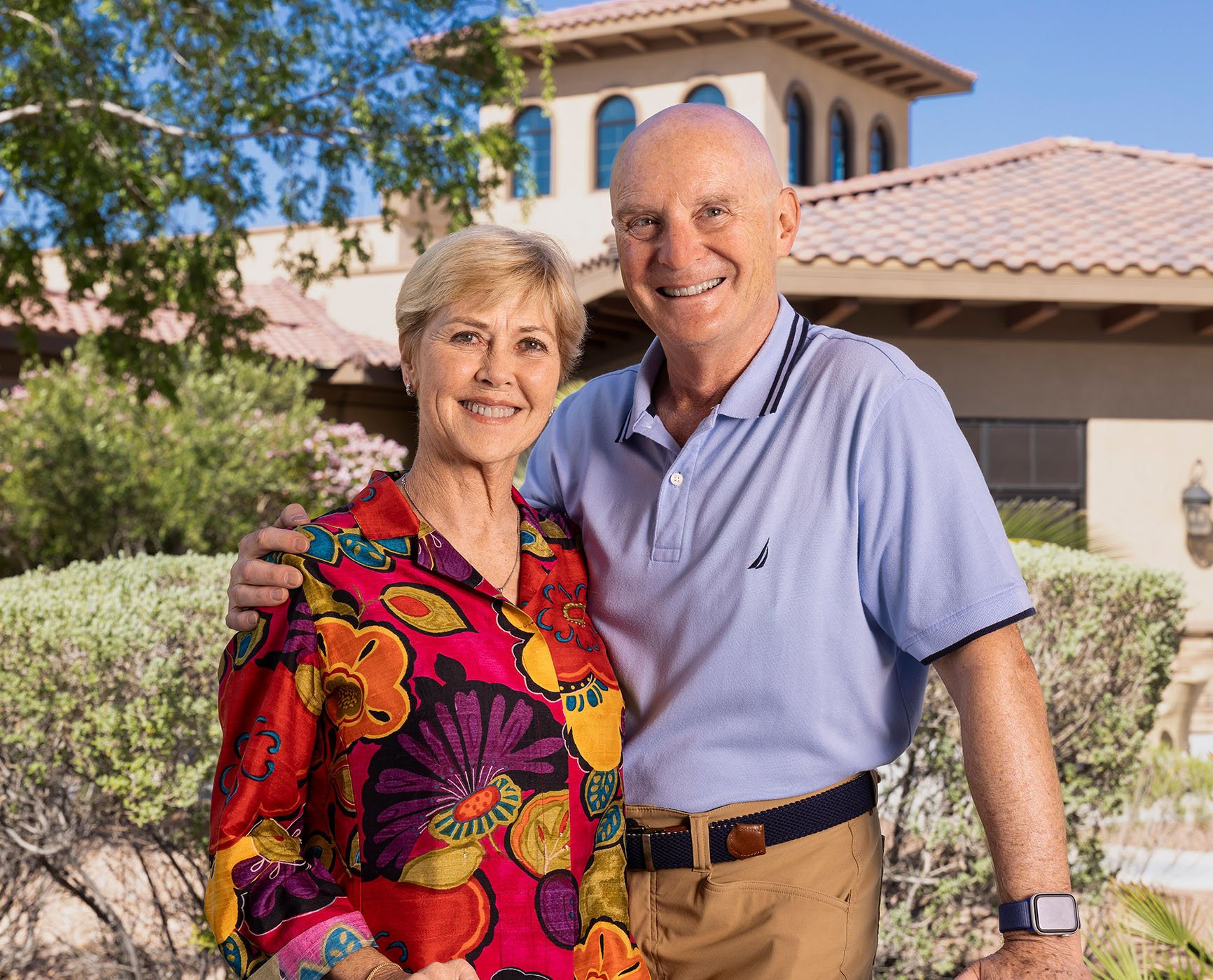 senior couple smiling outside