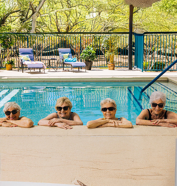 seniors enjoying their time at the outdoor pool