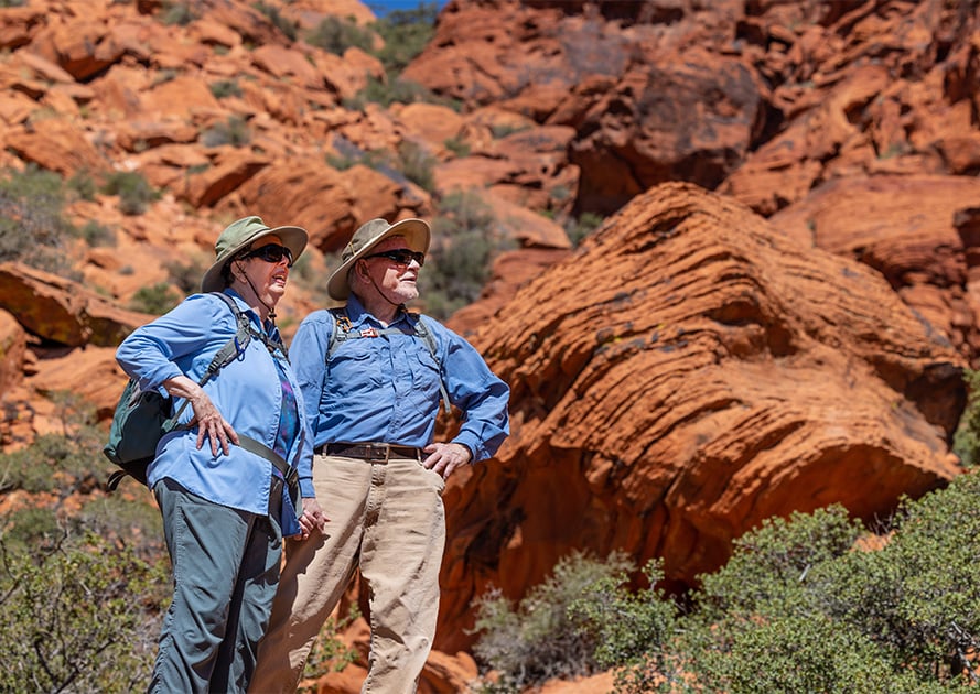 senior couple outside on a hike