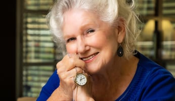 Vivian holding a pocket watch