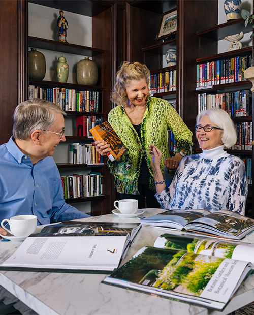 seniors sipping coffee and reading books a the library